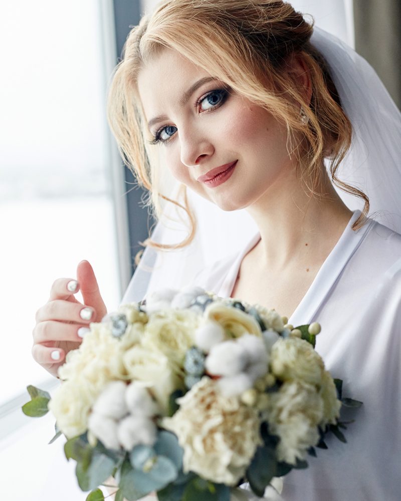 blonde-woman-with-bouquet-by-a-window-2026-01-08-05-15-22-utc.jpg
